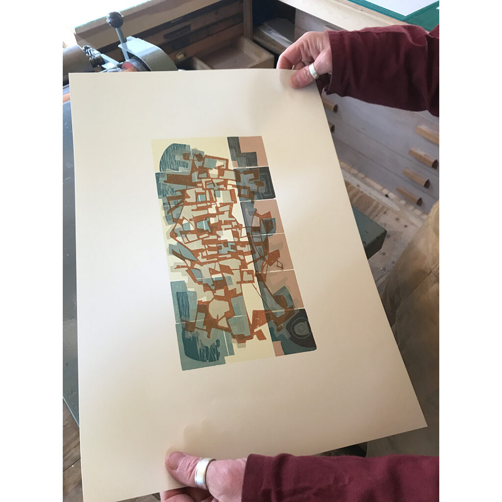Printing the top layer of Bungalow, a woodcut by Neil Bousfield